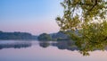 A serene summer dawn on the lake. Beautiful soft colors Royalty Free Stock Photo