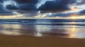 Serene Sunrise: Beach and Ocean Majesty Unveiled.