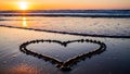 Serene sunset with heart-shaped shells on beach Royalty Free Stock Photo