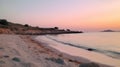 A serene sunset over a beach with soft pinks and oranges