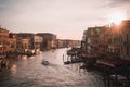 Serene sunset over Grand Canal in Venice with clear sky and beautiful water reflection