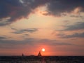 Serene Sunset over the Ocean with Sailboat in Waikiki, Hawaii Royalty Free Stock Photo