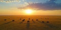 A serene sunset over a savannah with elephants grazing in the foreground Royalty Free Stock Photo