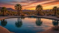 Palm Tree Reflections at Sunset by Tropical Oasis Swimming Pool in Desert Royalty Free Stock Photo