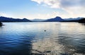 Serene tranquil deep blue sparkling water lake mountain ranges Royalty Free Stock Photo