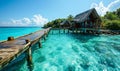 Serene tropical paradise with a wooden pier leading to overwater bungalows in a crystal-clear turquoise sea against a vibrant blue