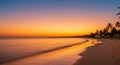 Serene Tropical Sunset Over a Calm Ocean Beach Royalty Free Stock Photo