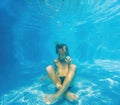 In serene underwater stillness, a boy finds tranquility in lotus position, embracing a moment of meditation in the Royalty Free Stock Photo