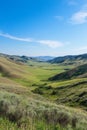 Serene Valley Landscape Under a Clear Sky Royalty Free Stock Photo