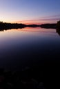 Serene view of calm lake and sunset clouds Royalty Free Stock Photo