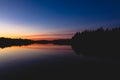 Serene view of calm lake and sunset clouds Royalty Free Stock Photo