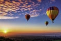 Serene view of a group of hot air balloons soaring above Royalty Free Stock Photo