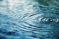 Serene Water Droplet Ripple on Blue Surface Royalty Free Stock Photo