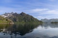 The serene waters of Trollfjorden mirror the rugged beauty of the Lofoten mountains Royalty Free Stock Photo