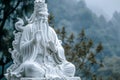 Serene white marble guan yu statue against misty background