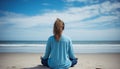 Serene woman engaged in yoga practice with breathtaking seashore view in the background