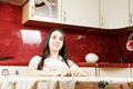 Serene woman in kitchen