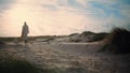 Serene woman walking sand dunes. Calm model silhouette enjoying seaside morning Royalty Free Stock Photo