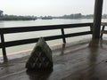 Serene wooden balcony by a tropical lake