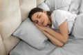 Peaceful european woman enjoying restful sleep