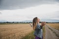 Serene young woman standing and meditating or practicing breathwork on a country road Royalty Free Stock Photo