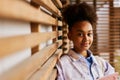 Serene youthful African American girl in casualwear Royalty Free Stock Photo