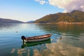 Serenity of autumn Mediterranean landscape. Montenegro, Adriatic Sea. View of Kotor Bay. Fishing boat on the water