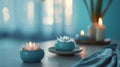 Serenity with candles and flower in a blue spa setting Royalty Free Stock Photo