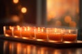 Serenity in Light: A Set of Six Tea Light Candles on Frosted Glass Tray with Soft Glow Royalty Free Stock Photo