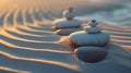 Serenity in nature: balanced stones on a rippled sand dune at sunset. peace, harmony, and zen captured in a soothing Royalty Free Stock Photo