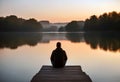 Serenity at Sunrise: Contemplation by the Lake Royalty Free Stock Photo