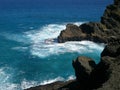 Serf and rocks on Island of Oahu Hawaii