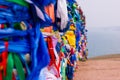 Serge. Sacred poles with colored ribbons in island Olkhon. Burkhan, Lake Baikal