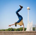 Sergey Pustovoyt. Man dancing yellow shirt blue jeans Royalty Free Stock Photo