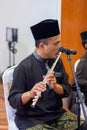 A man playing a Flutes on a wedding event