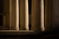 Series of architectural columns in a symmetrical formation along a path