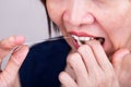 Series of Asian woman flossing teeth with oral floss