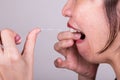 Series of Asian woman flossing teeth with oral floss Royalty Free Stock Photo