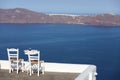 Series of beautiful Santorini Greece, chair and hotchpotch on a beautiful terance.