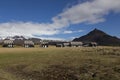 Series of black houses with grey roofs in Hellnar, Iceland