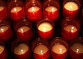 series of candles lit inside the place of worship to pray Royalty Free Stock Photo