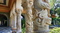 A series of decorative columns and archways adorned with detailed carvings of birds flowers and other natural elements Royalty Free Stock Photo