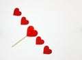 A series of five hearts, among them a candy in the shape of a he Royalty Free Stock Photo