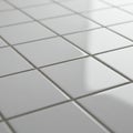 A series of glossy white ceramic tiles arranged in a neat grid pattern. Each tile is Royalty Free Stock Photo