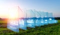Futuristic Digital Interface in a Green Field at Sunset Royalty Free Stock Photo