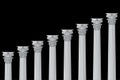 A series of Greek, antique, historic colonnades with Corinthian capitals and space for text on a black background