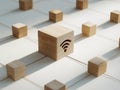 Wooden cubes connected by strings with central cube featuring carved wireless symbol representing network connectivity and Royalty Free Stock Photo