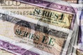 Series I and Series EE US Savings Bonds with 100 dollar bill overlay. Savings bonds are debt securities issued by the US