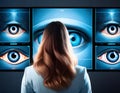 A series of interactive digital screens displaying animations of eyes following viewer\'s movements