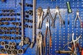 A SERIES OF MECHANICAL TOOLS INCLUDING VARIOUS PLIERS, SOCKET WRENCHES, SCISSORS AND EXTRACTORS